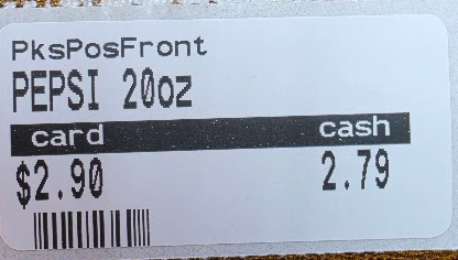Shelf label printed with a card price and a cash price